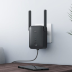 Compact Xiaomi WiFi Range Extender AC1200 2nd Gen plugged into a wall outlet
